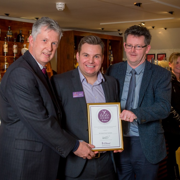 Patrick O'Shaughnessy of Visit Scotland presents Andy Hamar of Wild Thyme and Stuart Cassells of The Famous Grouse with their Taste Our Best accreditation.
