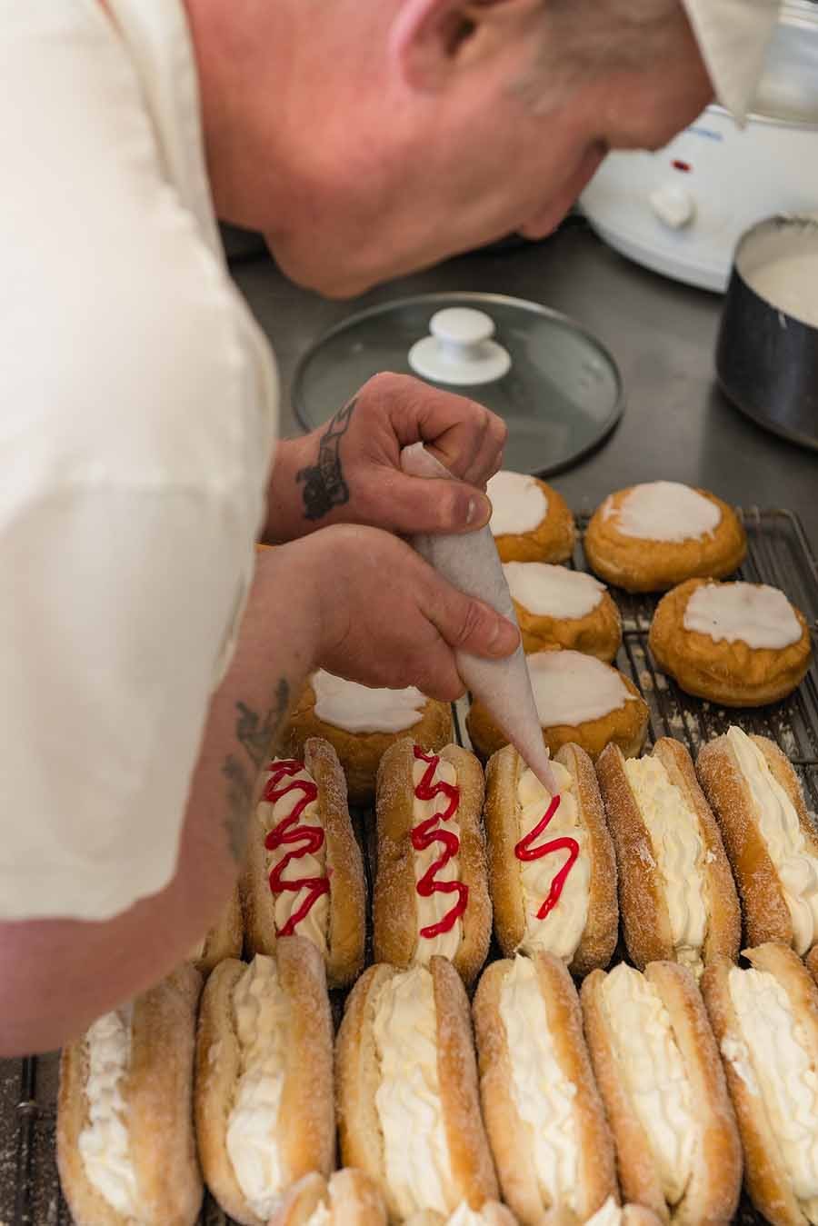 Careful work and steady hands at the cream finger station.