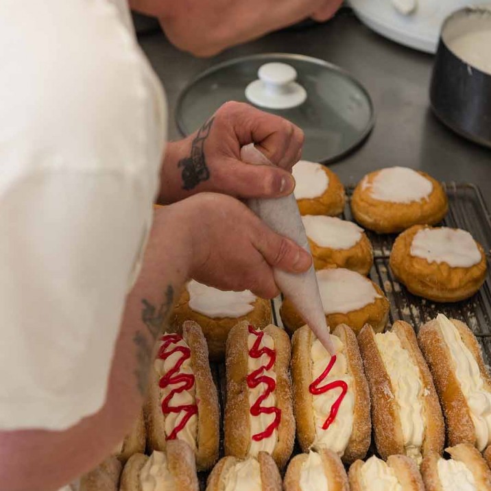 Careful work and steady hands at the cream finger station.