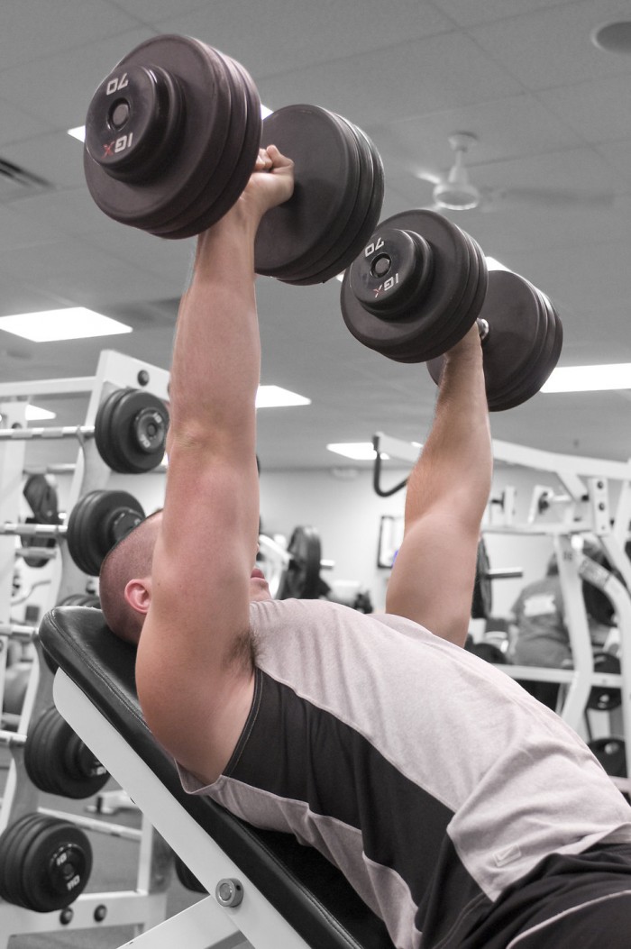Weightlifting - Man lifting dumbbells