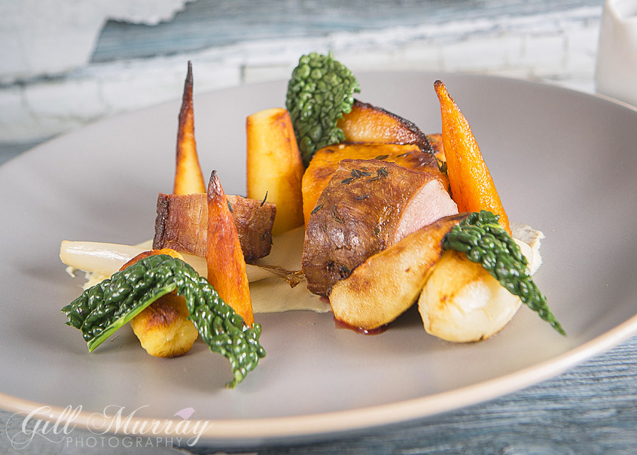 Haunch of venison, sweet potato fondant, roasted winter roots, pear and