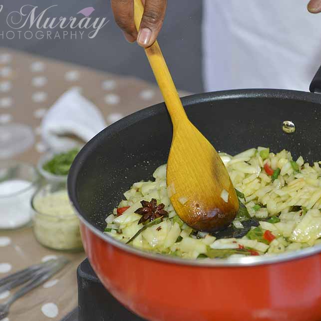 Praveen gets the onions going!