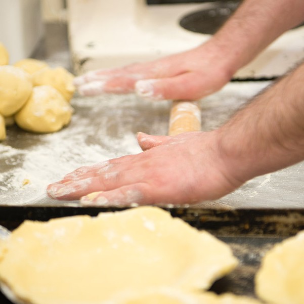 Looks like rolling out of apple pies to me!