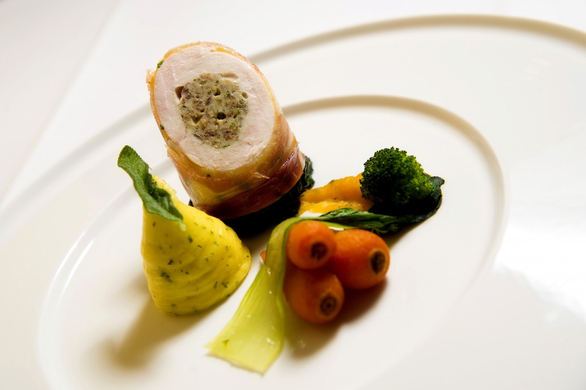 A flavour sensation - this free range chicken and haggis roulade is served with herb mash and seasonal vegetables.