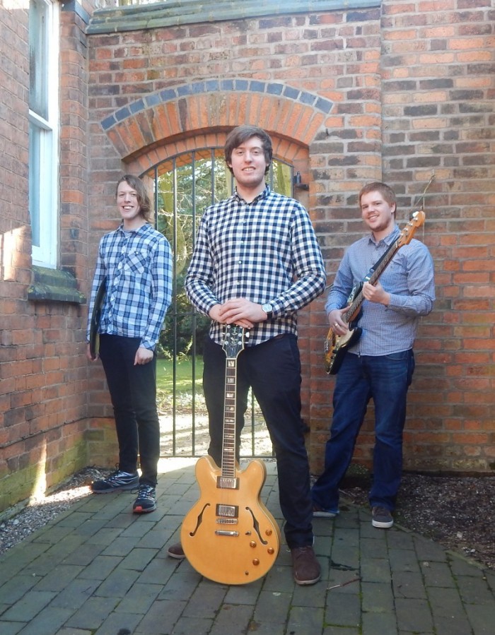 Allan Young (guitar), Stuart Barker (double bass) and Billy Weir (drums)