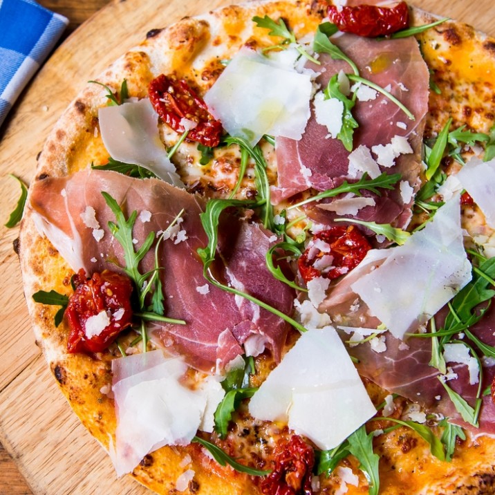 Pizza Paula: Tomato, Mozzarella, Proscuitto San Daniele, Rocket, Parmesan, Sun Blushed Tomato.