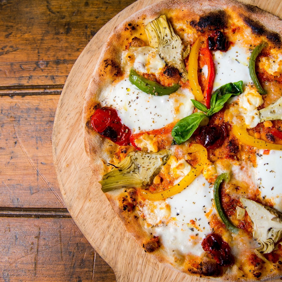 Pizza Sicilian: Artichokes, Roasted Peppers, Buffalo Mozzarella, Sun Blushed Tomatoes, Goat's Cheese, Red Pepper Pesto, Basil