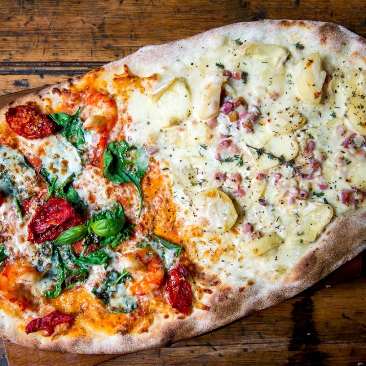 Pizza Mare and Montagne: 1/2 Tomato Mozzarella, Fresh Spinach, Hot Smoked Salmon, King Prawns, Sunblushed Tomato AND 1/2 Creme Fraiche, Potatoes, Bacon, Onions, Reblochon