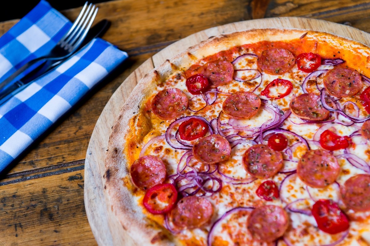 Pizza Diavola: Tomato, Mozzarella, Premium Pepperoni, Red Onions, Roquito Chillies