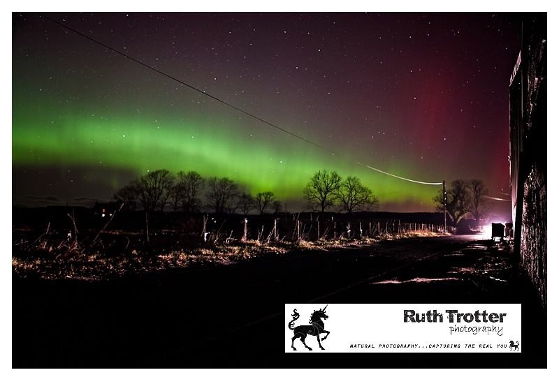 We see violet, green and gold ribbons in this beautiful scene over Bankfoot from Ruth Trotter.