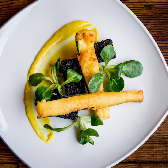 Stornoway Black Pudding with courgette buttermilk tempura, finished with a light
coconut and curry cream.