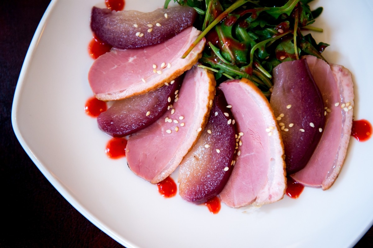 Smoked Duck & Poached Pear Salad - With 'Loch Rannoch' smoked duck & red wine poached pears served on a bed of crisp leaves, dressed in a raspberry vinaigrette & toasted sesame seeds.