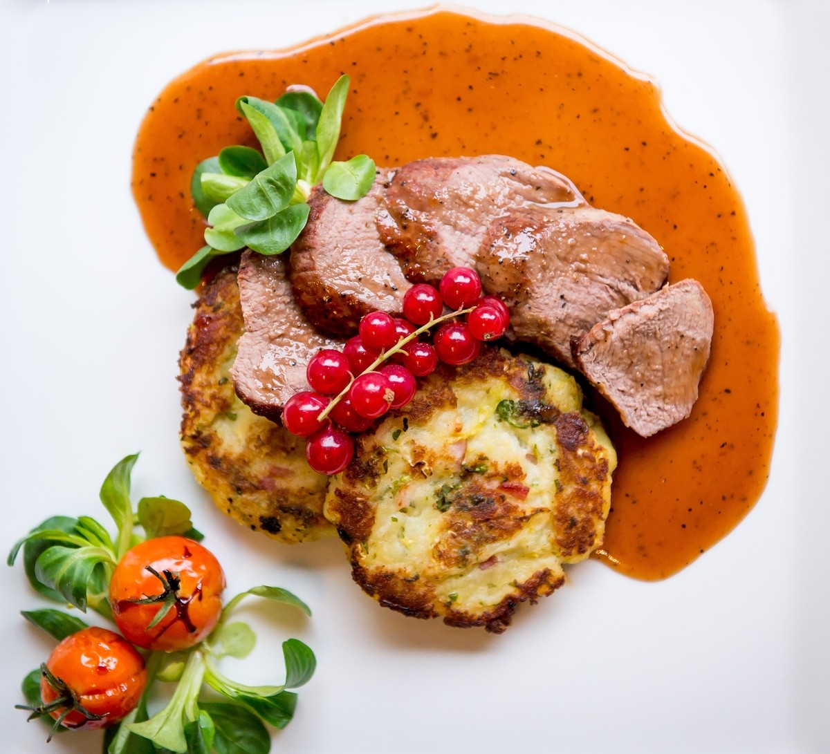 Fillet of Venison- Wild Scottish Venison with Rumbledthump patties, finished
with a rich sherry & redcurrant reduction.