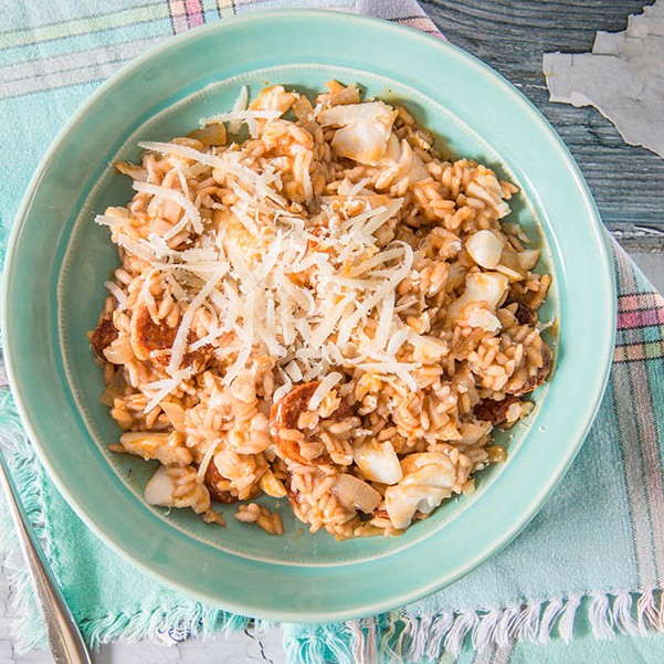 Yummy Cod and Chorizo Risotto served up with grated parmesan.