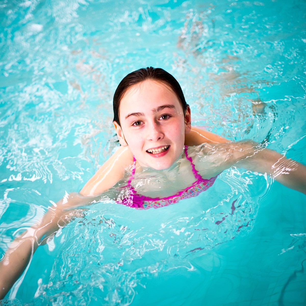 Swimming in the pool.