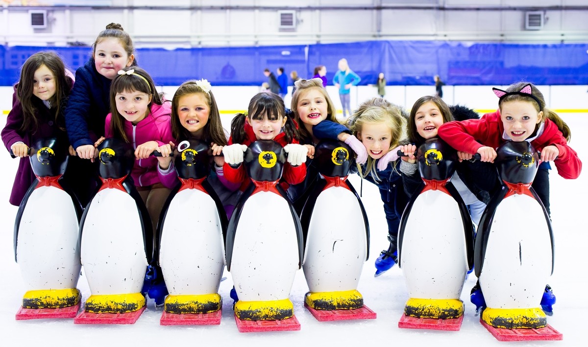 Kids having fun on the ice with the Penguin skate helpers!