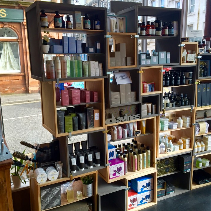 Open geometric box cabinet to promote the fantastic Davine Products, Cloud 9 styling tools and all the other lovely products that can be purchased in the salon.