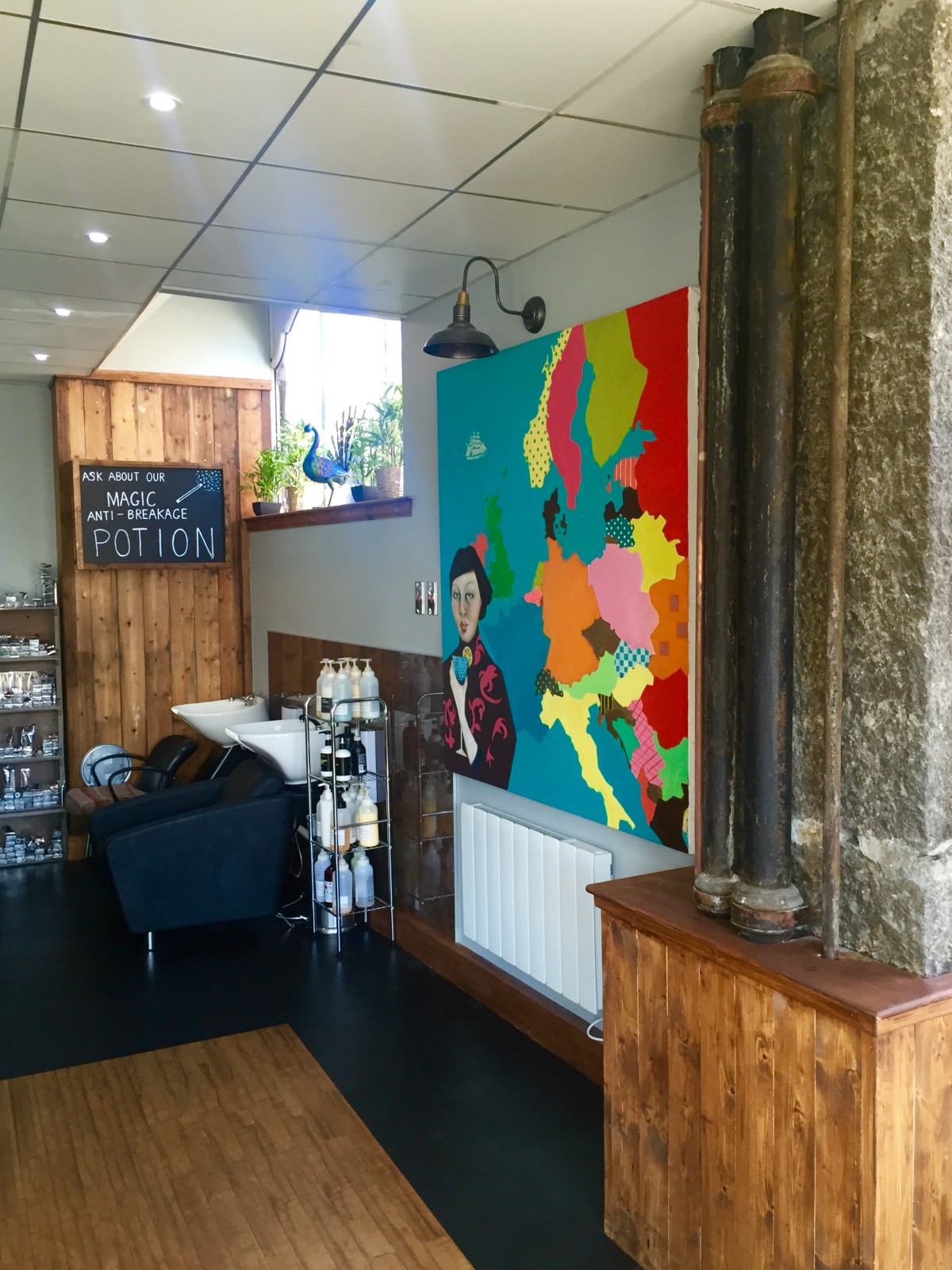 Quirky and modern new salon at Rae Peacock.  With modern pop art on the wall by the wash station.