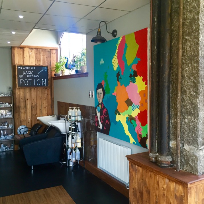 Quirky and modern new salon at Rae Peacock.  With modern pop art on the wall by the wash station.