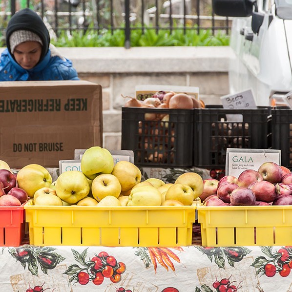 Baskets of lovely red and yellow fresh apples at the fruit market in New York.