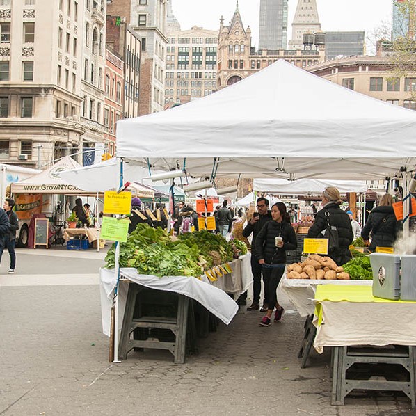 Gazebo stall with a range of fresh fruit and veg at the New York fruit market.