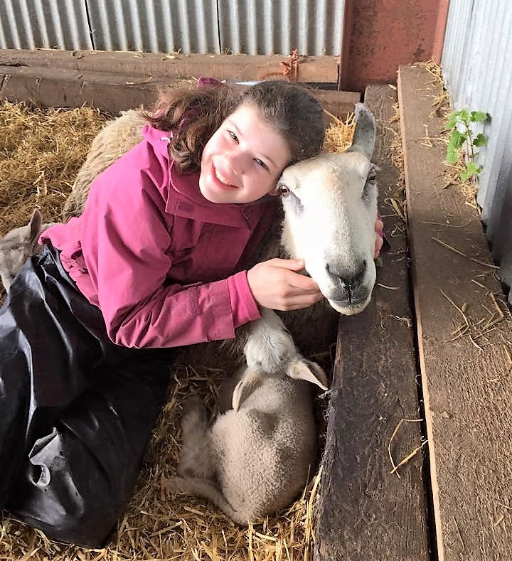 Anna sent us this picture of her cuddling Blue the sheep with her lamb. Anna stays on a farm so she has lots of 'pets!'