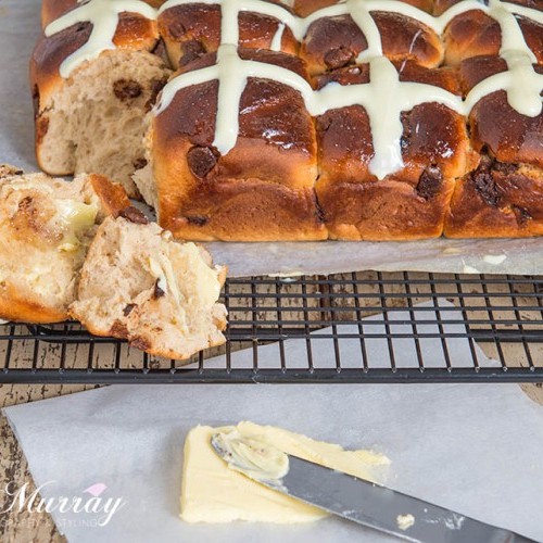 These Choc Chip Hot Cross Buns are a delicious twist on the traditional spiced fruit bun.  We absolutely loved these warmed oozing with chocolate!