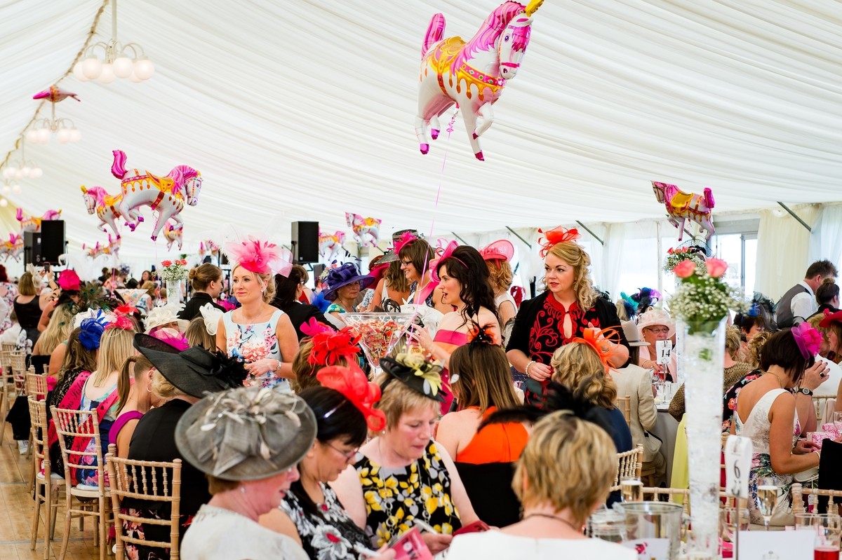 the tent was busy with people having a nice meal and making a real day of it at the 2016 Ladies day at Perth Racecourse.