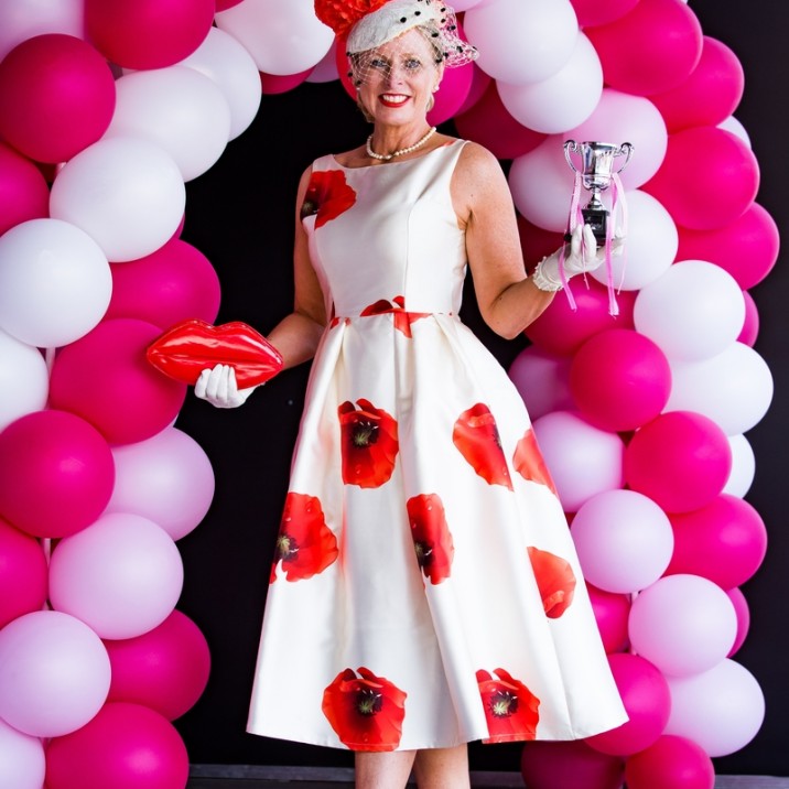 the best dressed lady at the 2016 Ladies Day at Perth Racecourse wowed in a poppy print dress with a gorgeous elegant hat, silk gloves and red heels.