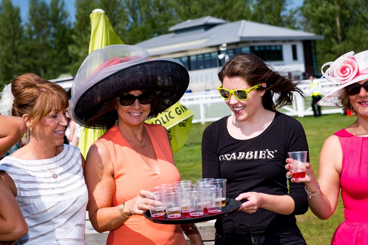Now that's a hat! The drinks were flowing at Ladies day and the ladies looked gorgeous in big hats and bright dresses.
