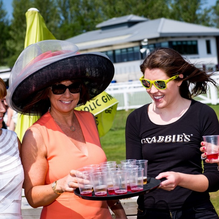 Now that's a hat! The drinks were flowing at Ladies day and the ladies looked gorgeous in big hats and bright dresses.