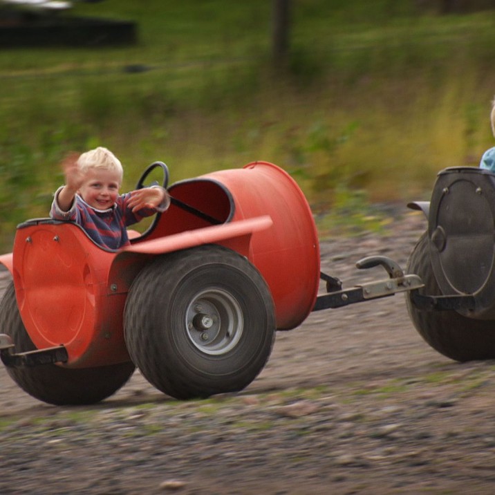 Even the little ones can enjoy the quad experience!  its a conga-line of five off-road pods pulled along by a big, muddy quad bike.