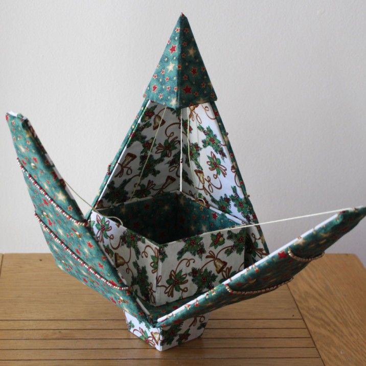 This amazing twist on the usual paper origami is Dee's Fabrigami.  These unusual fabric covered boxes are great fun!