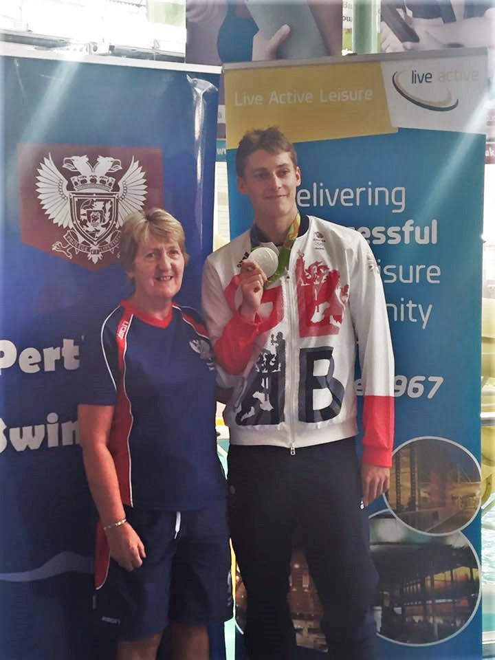 Stephen with his proud coach Ann Dickson who helped train him to become a Silver Olympic swimming champion.