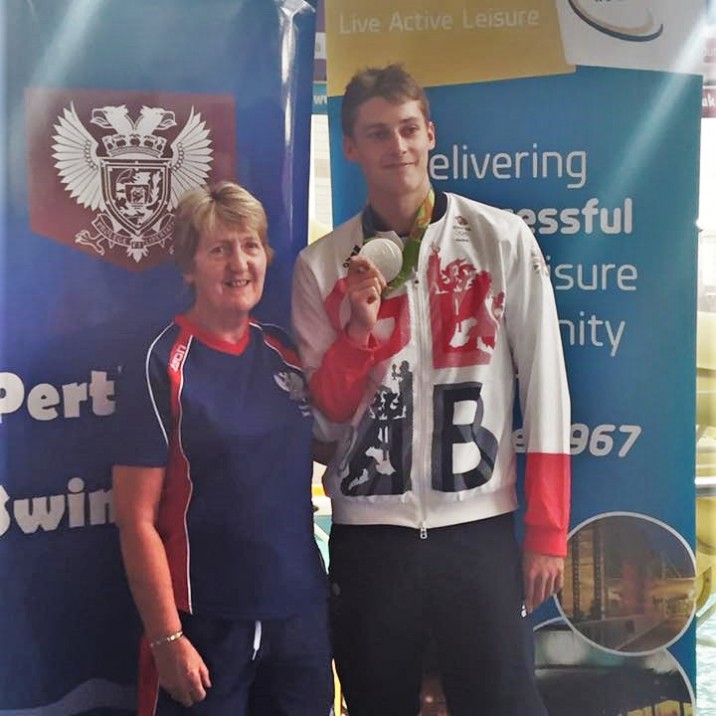 Stephen with his proud coach Ann Dickson who helped train him to become a Silver Olympic swimming champion.