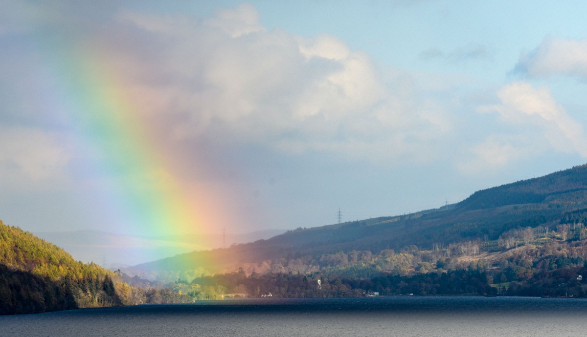 A rainbow lands lights up a Perthshire town in the background.