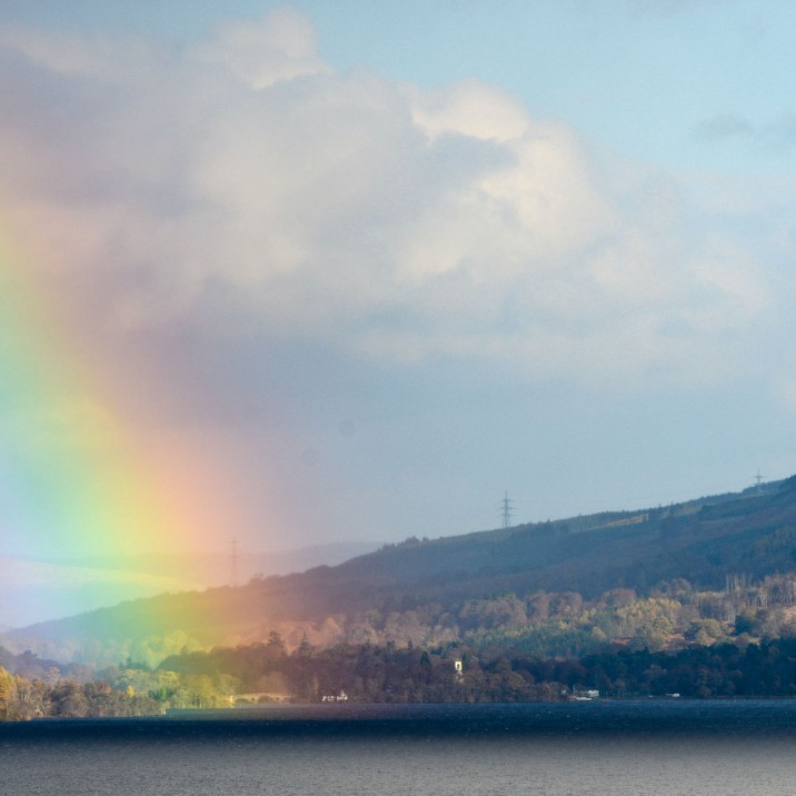 A rainbow lands lights up a Perthshire town in the background.