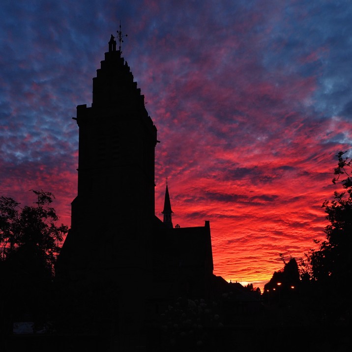 Tom Ryan took this picture of the shadow of Scone Kirk with the firey sky behind.  It almost looks like a dragon has blown fire into the sky.