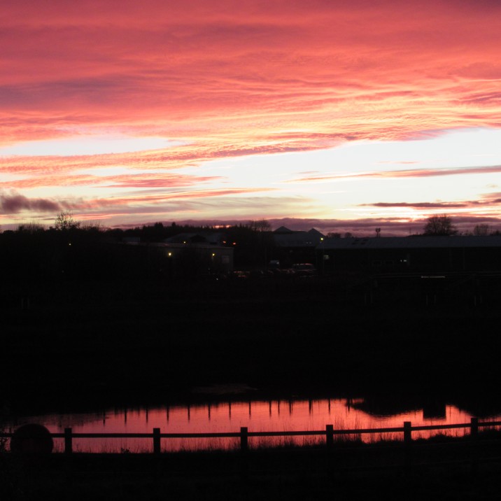 This picture by Gordon Muir shows the beautiful red and orange sky reflected into a small pond below.
