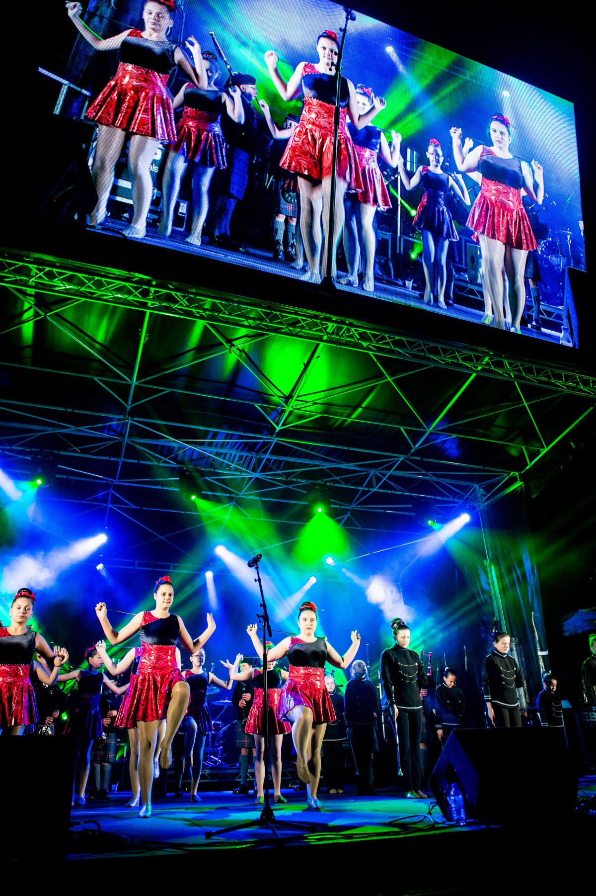 Energetic dancers put on a spectacular show on stage and big screen