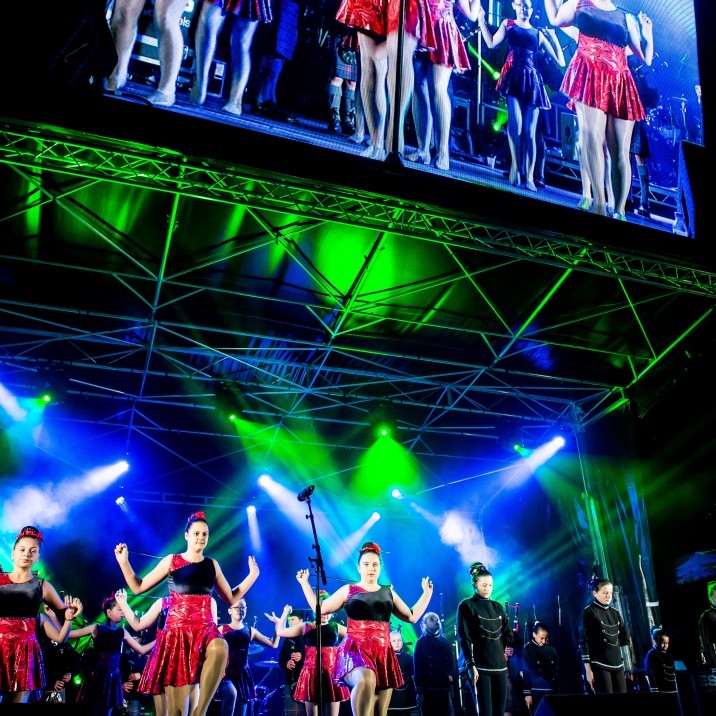 Energetic dancers put on a spectacular show on stage and big screen
