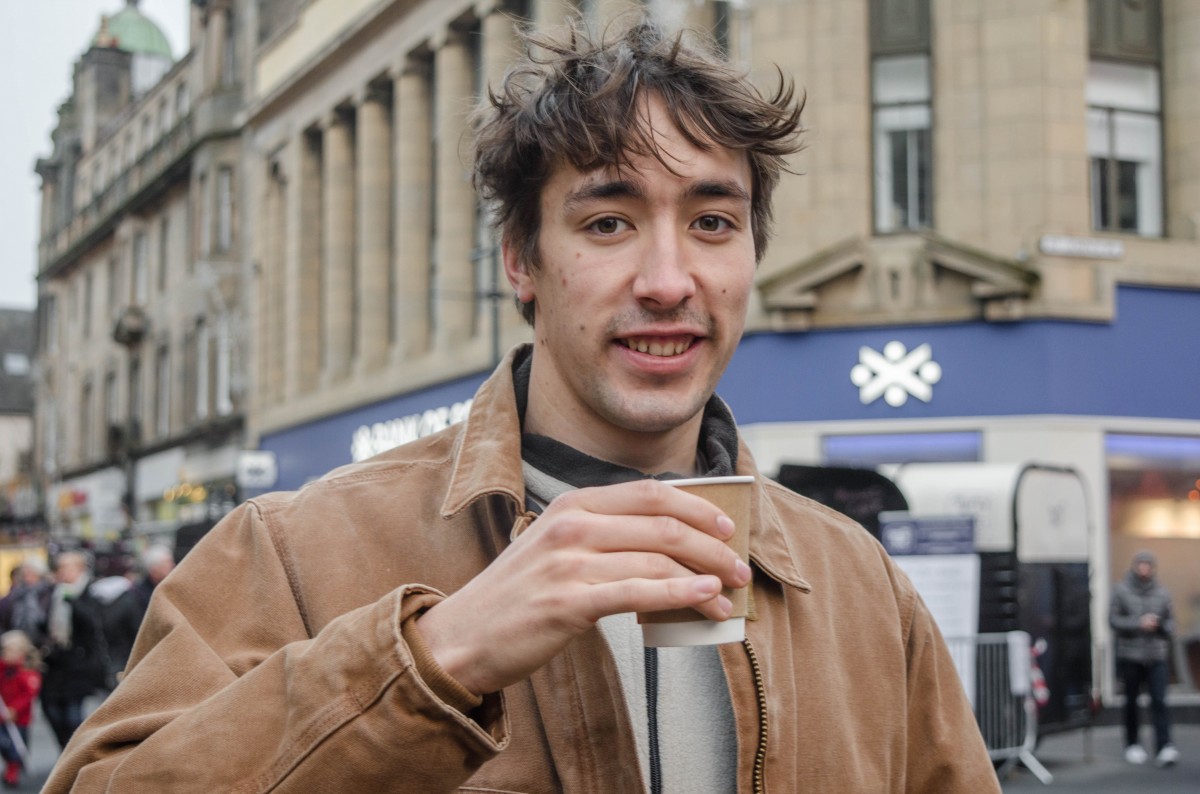 Cain taking a break from being behind the camera and enjoying a coffee break at the Christmas Light Switch On.