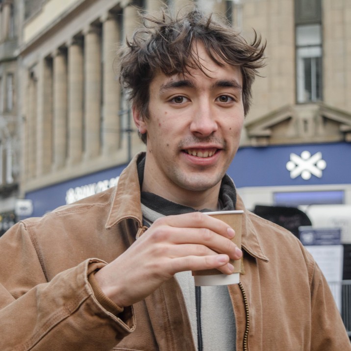 Cain taking a break from being behind the camera and enjoying a coffee break at the Christmas Light Switch On.