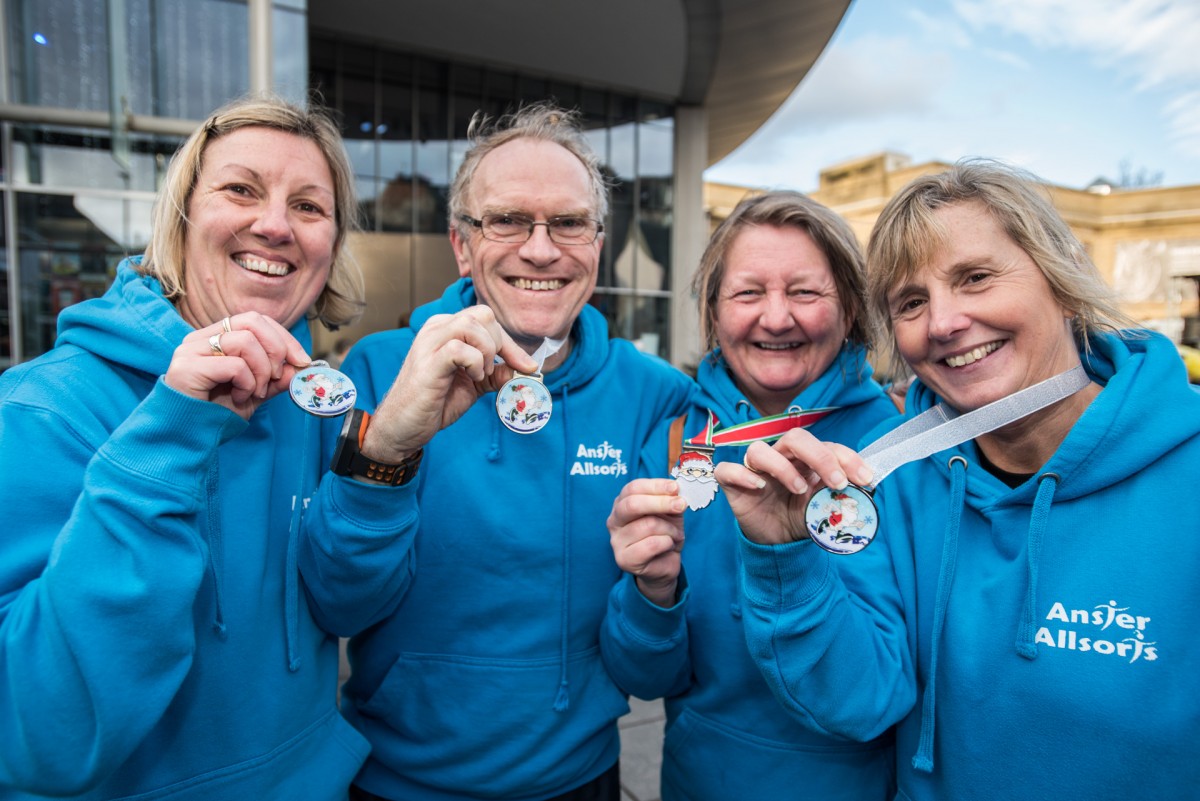The group from Anster Allsorts show off their finishers medals.