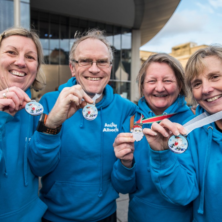 The group from Anster Allsorts show off their finishers medals.