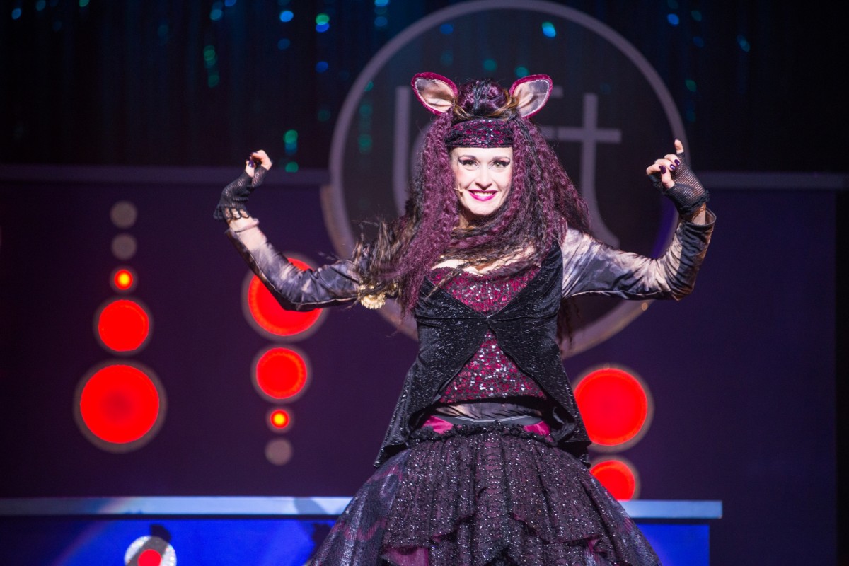 Kitty Cat the rat catcher stands side by side with Dick in the final showdown.