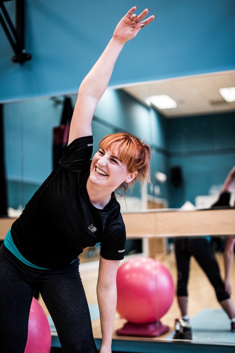 Live Active woman leaning over