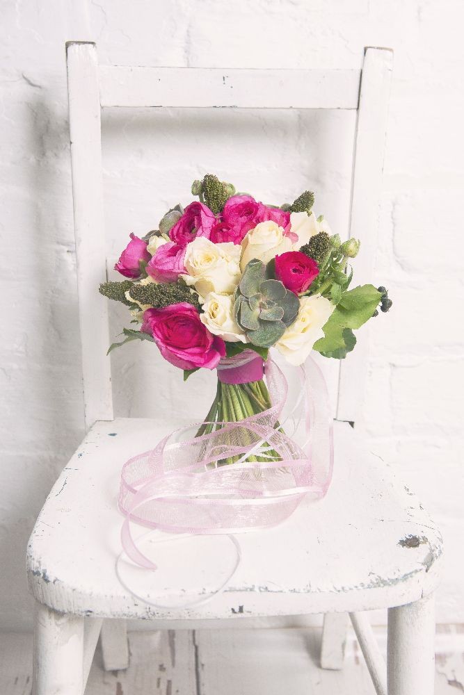 Rose House pink bouquet on chair