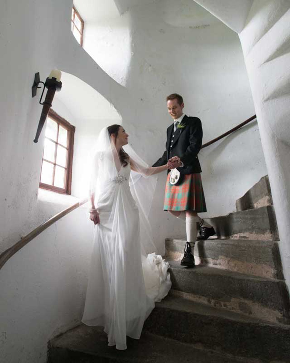 Neil Fordyce bride and groom coming down stairs