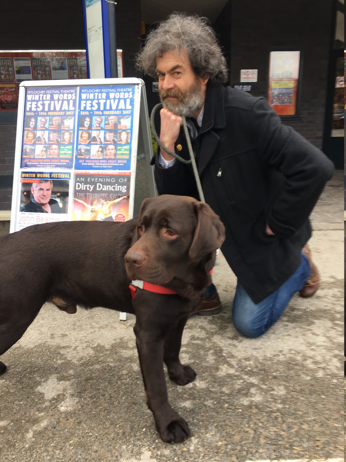 Dougal and his dog outside Pitlochry Festival Theatre with author Fiona Rintoul's beautiful chocolate labrador.